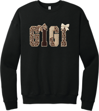 Grandma Leopard Applique crewneck sweatshirt in Black, featuring GIGI spelled out in leopard, cream, and chocolate patches with a scalloped stitched applique look and two bows
