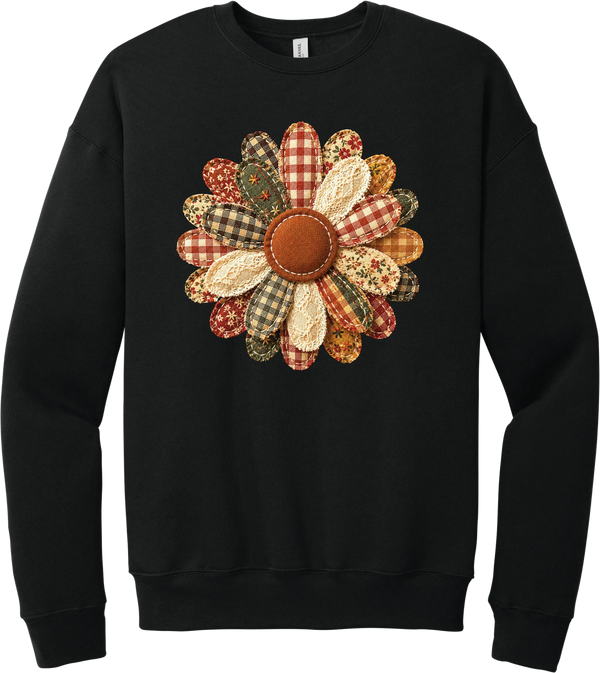 Patchwork Fabric Flower crewneck sweatshirt in Black, featuring an oversized fabric flower with plaid, gingham, calico, and cable knit petals around a stitched rust center