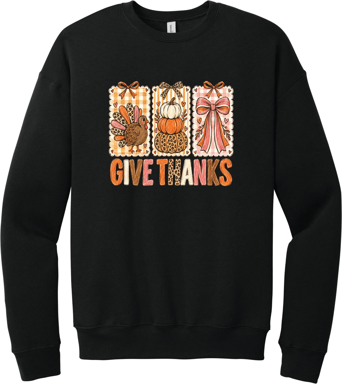 Give Thanks Coquette crewneck sweatshirt in Black, featuring three bow-topped stamp panels with a turkey, stacked pumpkins, and a pink bow above Give Thanks in patchwork letters