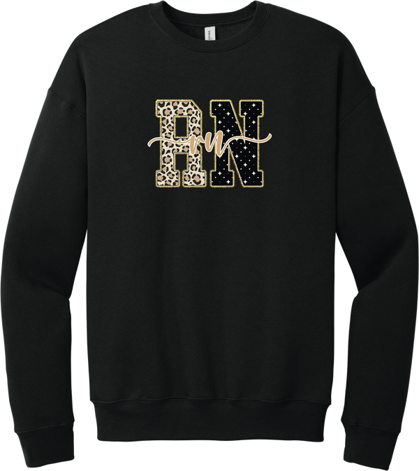 Glitzy Patterned RN crewneck sweatshirt in Black, featuring RN block letters in leopard and sparkle star patterns with a gold glitter outline and rn script