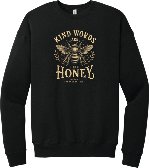 Kind Words Honey Bee crewneck sweatshirt in Black, featuring Kind Words Are Like Honey in arched vintage lettering around a golden honey bee and honeycomb with Proverbs 16:24