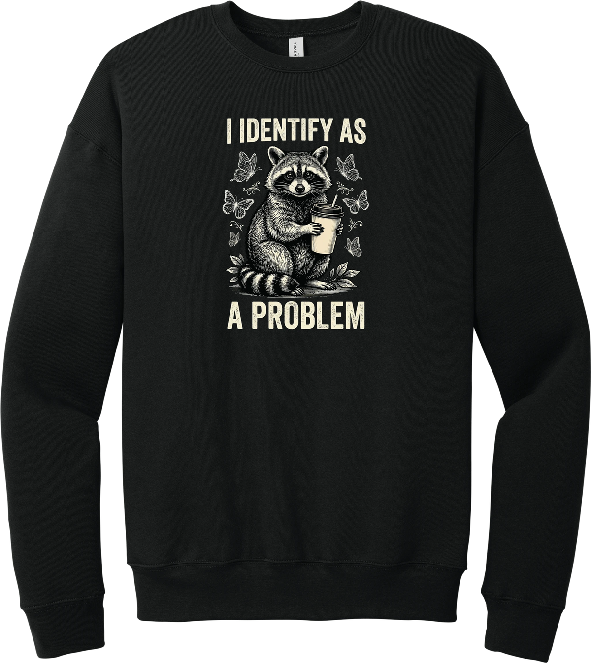 I Identify as a Problem crewneck sweatshirt in Black, featuring a raccoon holding a coffee cup surrounded by butterflies with I identify as a problem