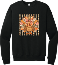 Preppy Turkey crewneck sweatshirt in Black, featuring a smiling turkey with gingham and leopard feathers and a pink bow on a leopard stripe background