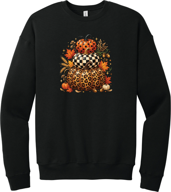 All Stacked Up crewneck sweatshirt in Black, featuring three stacked pumpkins in polka dot, checkerboard, and leopard with autumn leaves