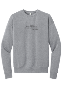 Coco Chanel Who and What Quote crewneck sweatshirt in Athletic Heather, featuring A girl should be two things who and what she wants in distressed black typewriter letters