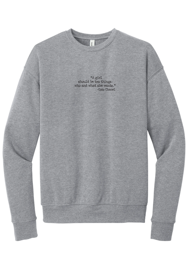 Coco Chanel Who and What Quote crewneck sweatshirt in Athletic Heather, featuring A girl should be two things who and what she wants in distressed black typewriter letters