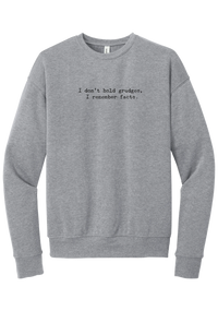 I Don't Hold Grudges crewneck sweatshirt in Athletic Heather, featuring I don't hold grudges, I remember facts in distressed black typewriter letters