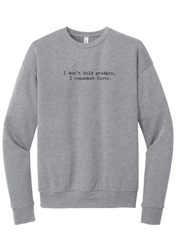 I Don't Hold Grudges crewneck sweatshirt in Athletic Heather, featuring I don't hold grudges, I remember facts in distressed black typewriter letters