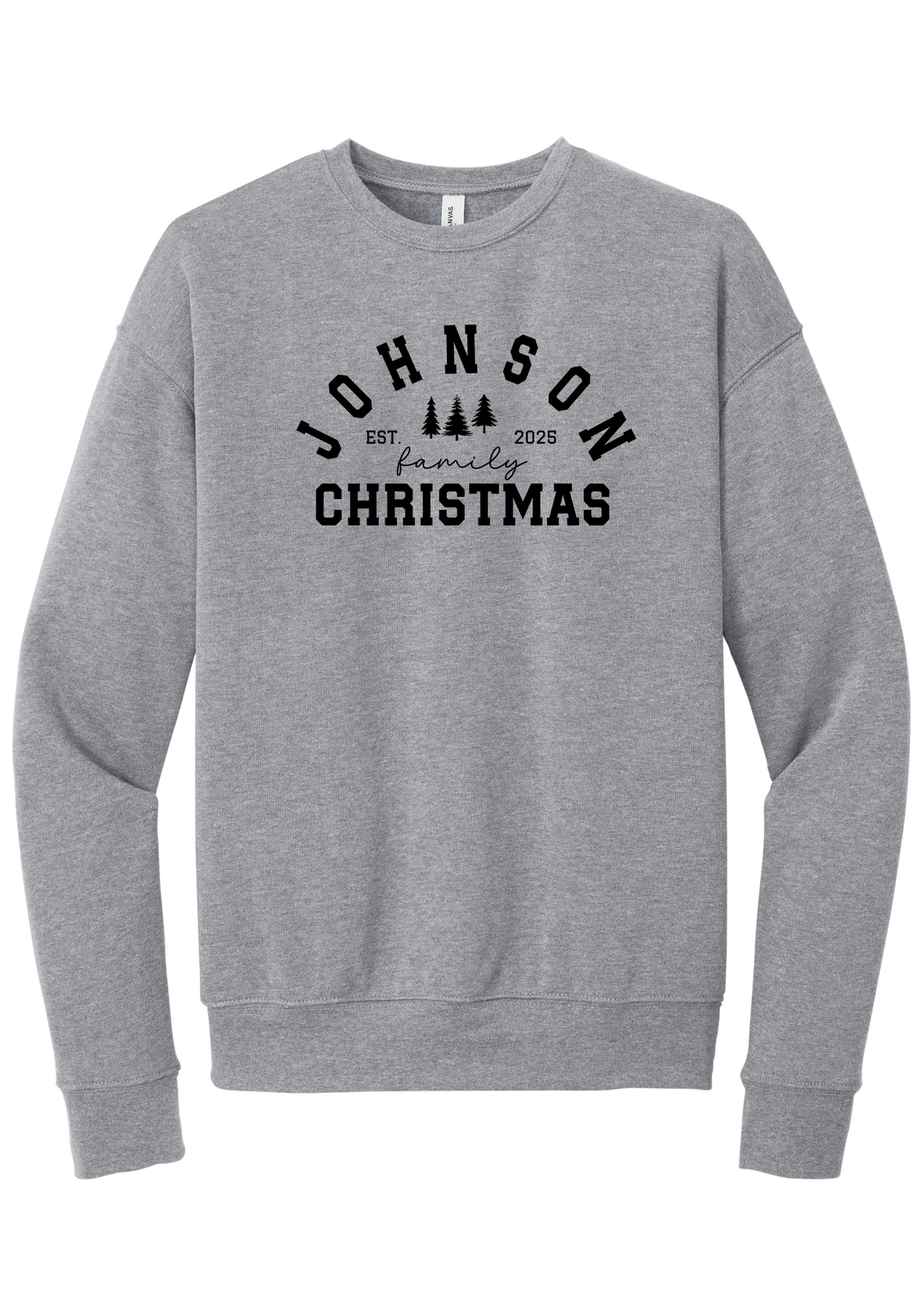 Personalized Family Christmas crewneck sweatshirt in Athletic Heather, featuring an arched family name over pine trees with EST. year and family Christmas lettering