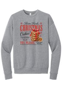 Farm Fresh Christmas Cookies crewneck sweatshirt in Athletic Heather, featuring a vintage farmhouse bakery sign with a stack of Christmas cookies tied in a red bow, a dried orange slice, and red and black lettering