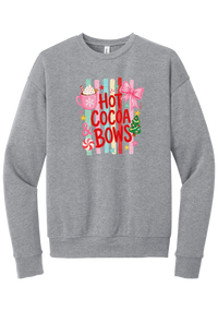 Hot Cocoa and Bows crewneck sweatshirt in Athletic Heather, featuring red HOT COCOA and BOWS letters on pastel stripes with a cocoa mug and a pink bow
