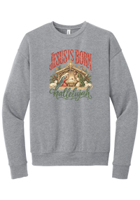 Jesus Is Born Hallelujah crewneck sweatshirt in Athletic Heather, featuring a vintage nativity scene under a golden star with Jesus Is Born lettering and Hallelujah script