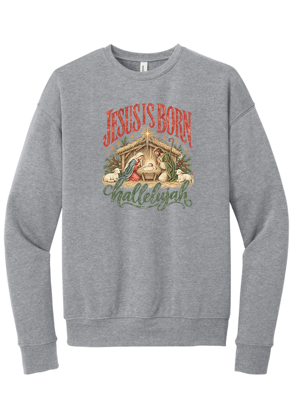 Jesus Is Born Hallelujah crewneck sweatshirt in Athletic Heather, featuring a vintage nativity scene under a golden star with Jesus Is Born lettering and Hallelujah script