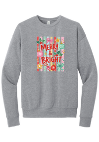 Merry and Bright Striped crewneck sweatshirt in Athletic Heather, featuring red MERRY and BRIGHT letters on pink and green stripes with ornaments and holly