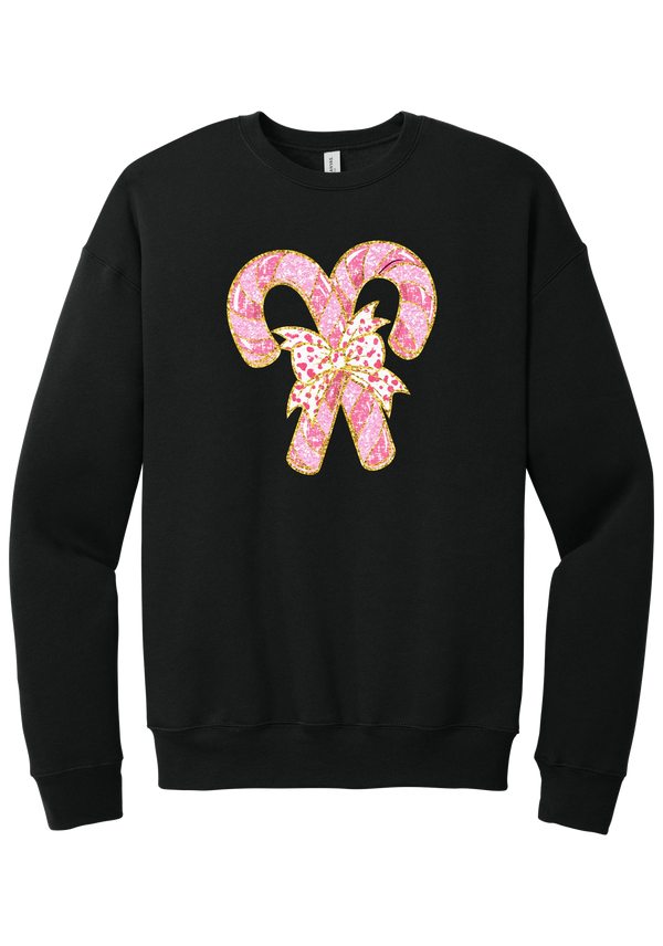 Candy Cane Bow crewneck sweatshirt in Black, featuring two pink glitter candy canes tied with a leopard heart bow and gold trim