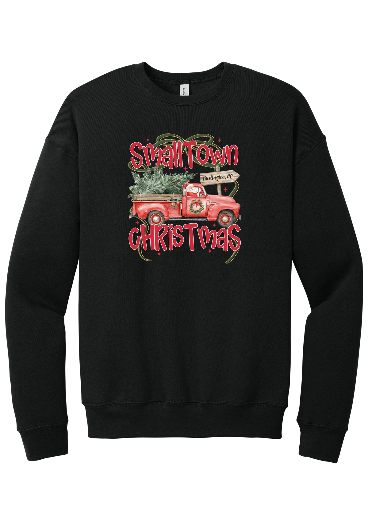 Personalized Small Town Christmas crewneck sweatshirt in Black, featuring Santa in a vintage red pickup truck hauling a Christmas tree past a personalized town road sign, with red Small Town Christmas lettering