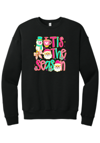 Tis the Season Snowman crewneck sweatshirt in Black, featuring pink and teal TIS THE SEASON letters with a snowman, a cocoa mug, and Santas