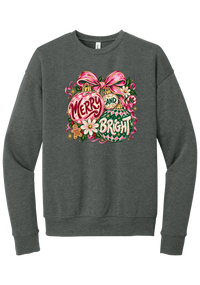 Merry and Bright Ornaments crewneck sweatshirt in Deep Heather, featuring hand-painted pink and green ornaments reading Merry and Bright with a pink bow, holly, daisies, a candy cane, and a gingerbread man