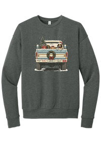 Christmas Pickup Truck with Dog crewneck sweatshirt in Deep Heather, featuring a vintage pickup truck with a Christmas tree, wrapped gifts, a tailgate wreath, and a dog in a Santa hat