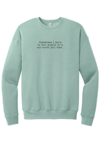 Not Worth Jail Time crewneck sweatshirt in Dusty Blue, featuring Sometimes I have to tell myself it's not worth jail time in distressed black typewriter letters