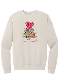 Adore Him Ribbon Tree crewneck sweatshirt in Heather Dust, featuring a colorful ribbon Christmas tree with a pink bow over Oh Come Let Us Adore Him script