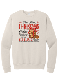 Farm Fresh Christmas Cookies crewneck sweatshirt in Heather Dust, featuring a vintage farmhouse bakery sign with a stack of Christmas cookies tied in a red bow, a dried orange slice, and red and black lettering