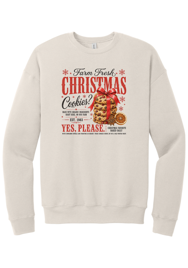 Farm Fresh Christmas Cookies crewneck sweatshirt in Heather Dust, featuring a vintage farmhouse bakery sign with a stack of Christmas cookies tied in a red bow, a dried orange slice, and red and black lettering