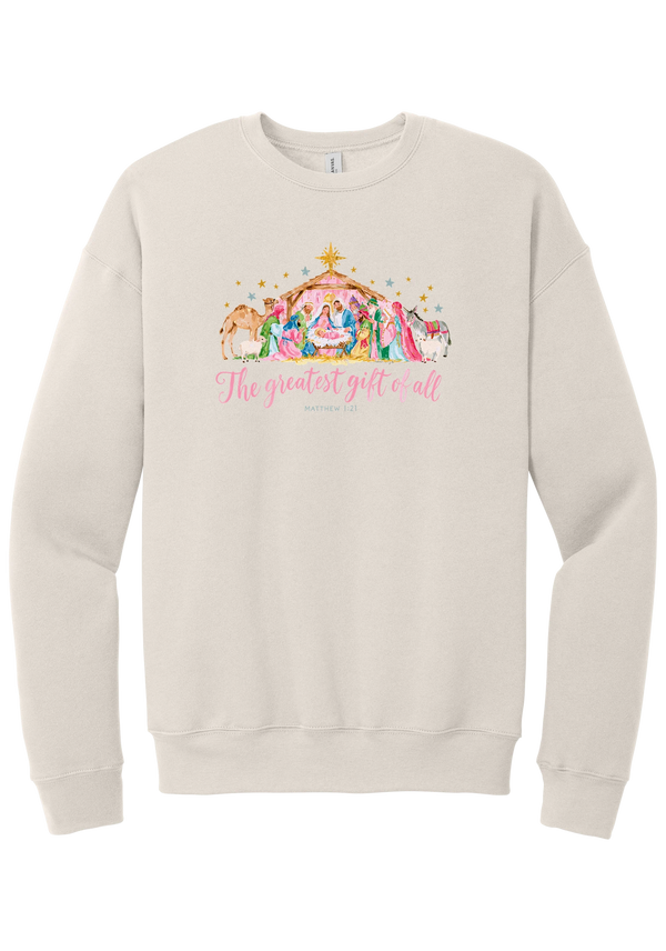The Greatest Gift of All crewneck sweatshirt in Heather Dust, featuring a pastel watercolor nativity scene under the star with The Greatest Gift of All script and Matthew 1:21