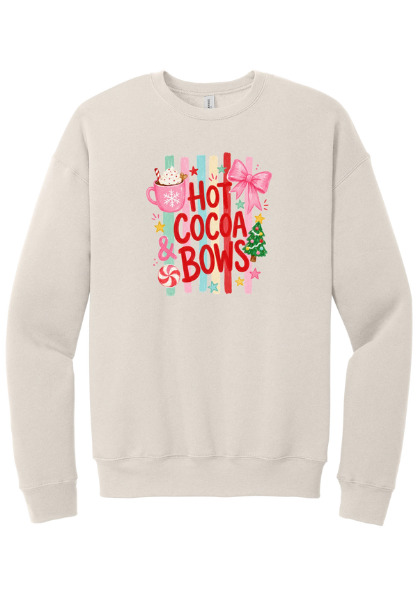 Hot Cocoa and Bows crewneck sweatshirt in Heather Dust, featuring red HOT COCOA and BOWS letters on pastel stripes with a cocoa mug and a pink bow