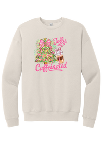 Jolly and Caffeinated crewneck sweatshirt in Heather Dust, featuring a pink bow Christmas tree and an iced coffee with Jolly and Caffeinated script