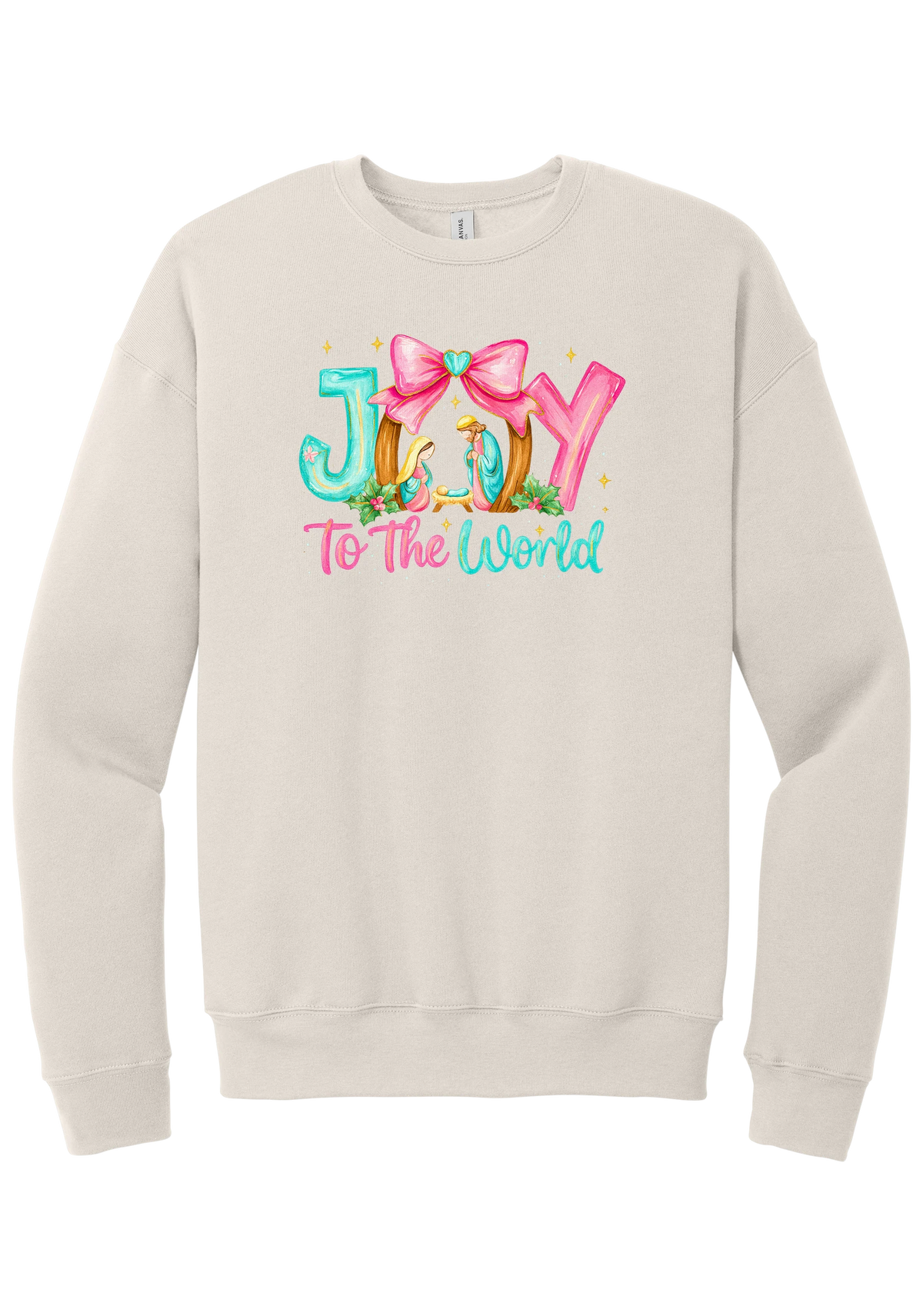 Joy to the World Nativity crewneck sweatshirt in Heather Dust, featuring painted JOY letters framing a nativity scene with a pink bow and To The World script