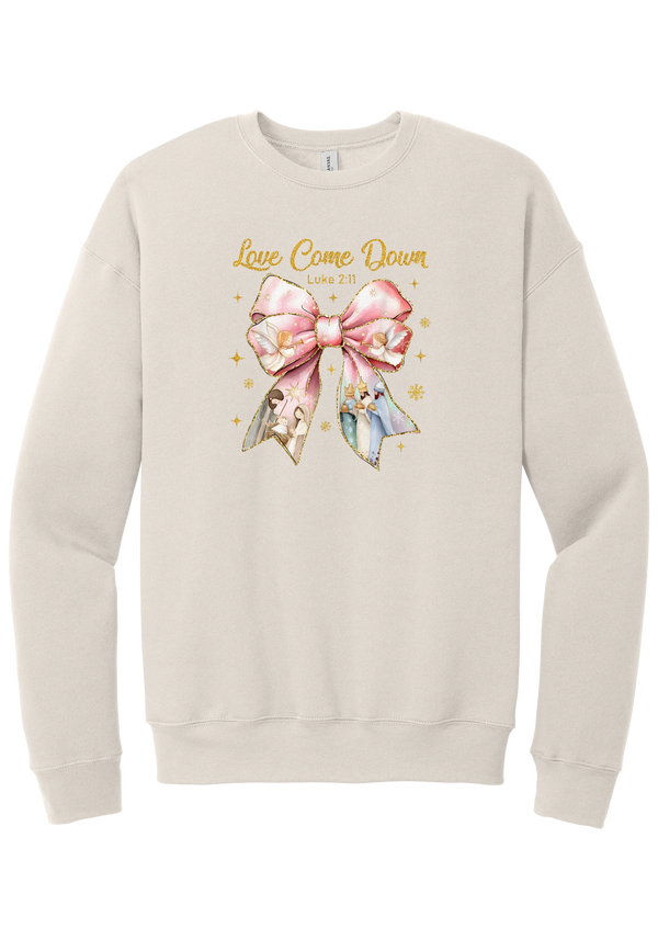 Love Came Down Nativity Bow crewneck sweatshirt in Heather Dust, featuring a blush satin bow with painted nativity scenes under gold Love Came Down script and Luke 2:11