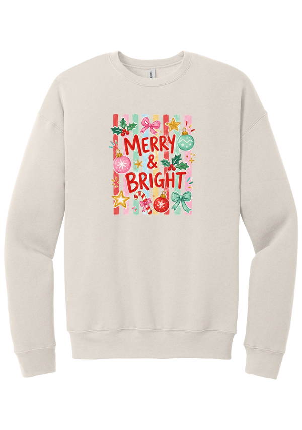 Merry and Bright Striped crewneck sweatshirt in Heather Dust, featuring red MERRY and BRIGHT letters on pink and green stripes with ornaments and holly
