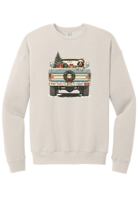 Christmas Pickup Truck with Dog crewneck sweatshirt in Heather Dust, featuring a vintage pickup truck with a Christmas tree, wrapped gifts, a tailgate wreath, and a dog in a Santa hat