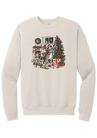 Raccoon Christmas crewneck sweatshirt in Heather Dust, featuring a vintage-style raccoon in a Santa hat and plaid scarf decorating a Christmas tree by the fireplace with ribbon and gifts scattered around