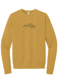 Coco Chanel Who and What Quote crewneck sweatshirt in Heather Mustard, featuring A girl should be two things who and what she wants in distressed black typewriter letters