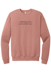 Not Worth Jail Time crewneck sweatshirt in Mauve, featuring Sometimes I have to tell myself it's not worth jail time in distressed black typewriter letters