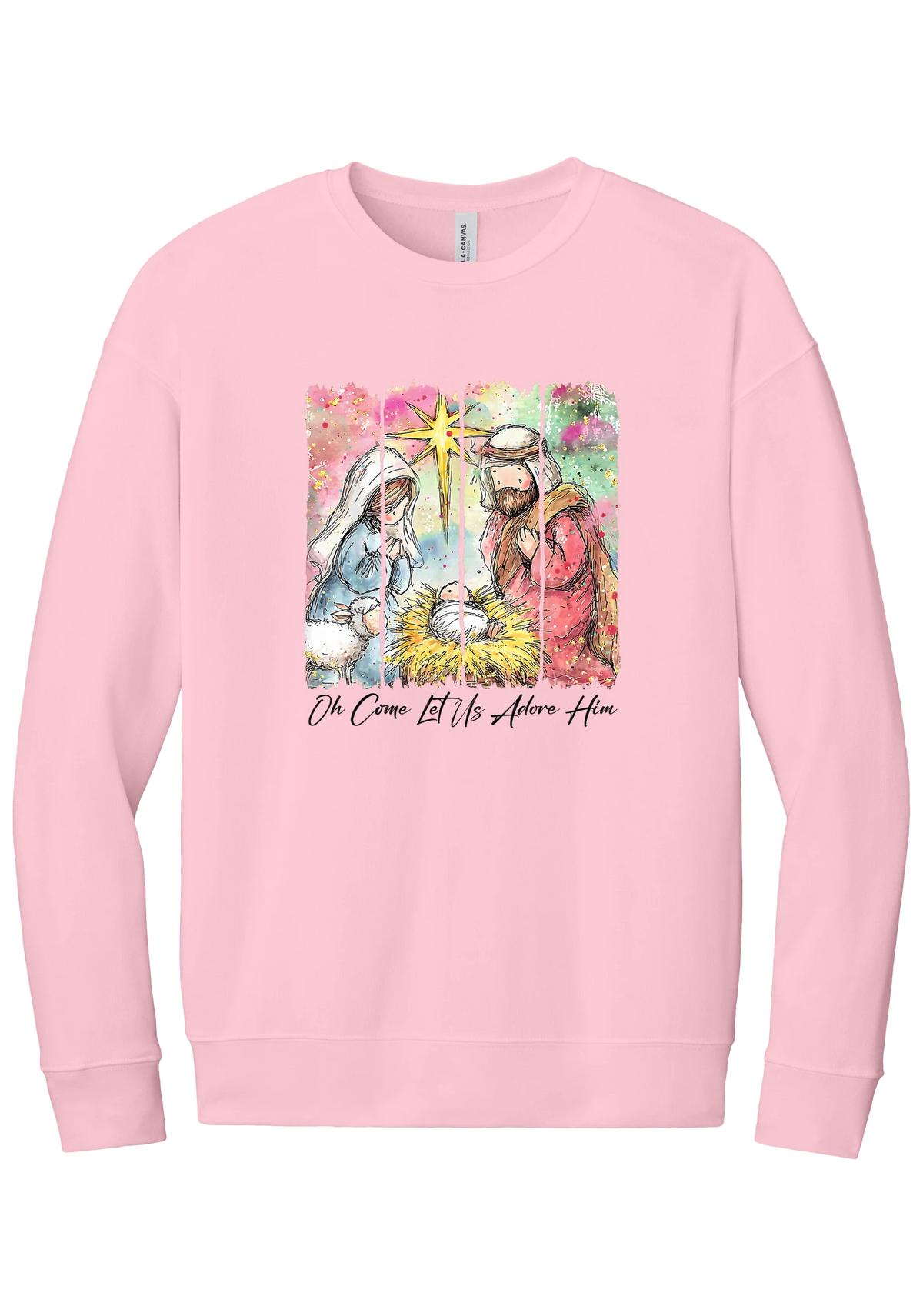 Adore Him Painted Nativity crewneck sweatshirt in Pink, featuring a watercolor nativity of Mary, Joseph, and baby Jesus under a star with Oh Come Let Us Adore Him script
