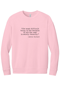 Amelia Earhart Tenacity Quote crewneck sweatshirt in Pink, featuring The most difficult thing is the decision to act the rest is merely tenacity in distressed black typewriter letters