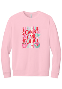 Candy Cane Cutie crewneck sweatshirt in Pink, featuring red CANDY CANE CUTIE letters on pastel stripes with candy canes, cocoa, and bows