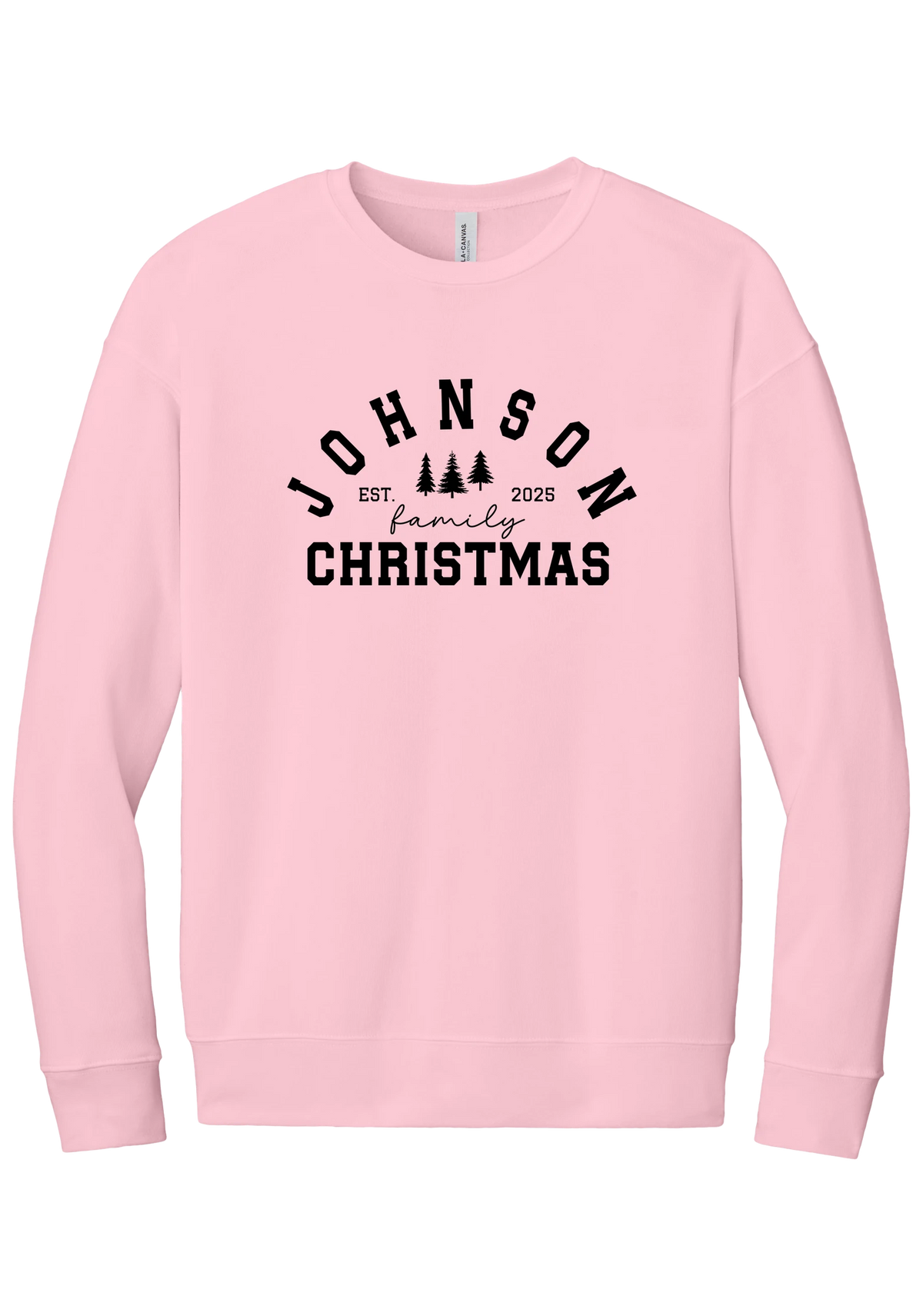 Personalized Family Christmas crewneck sweatshirt in Pink, featuring an arched family name over pine trees with EST. year and family Christmas lettering