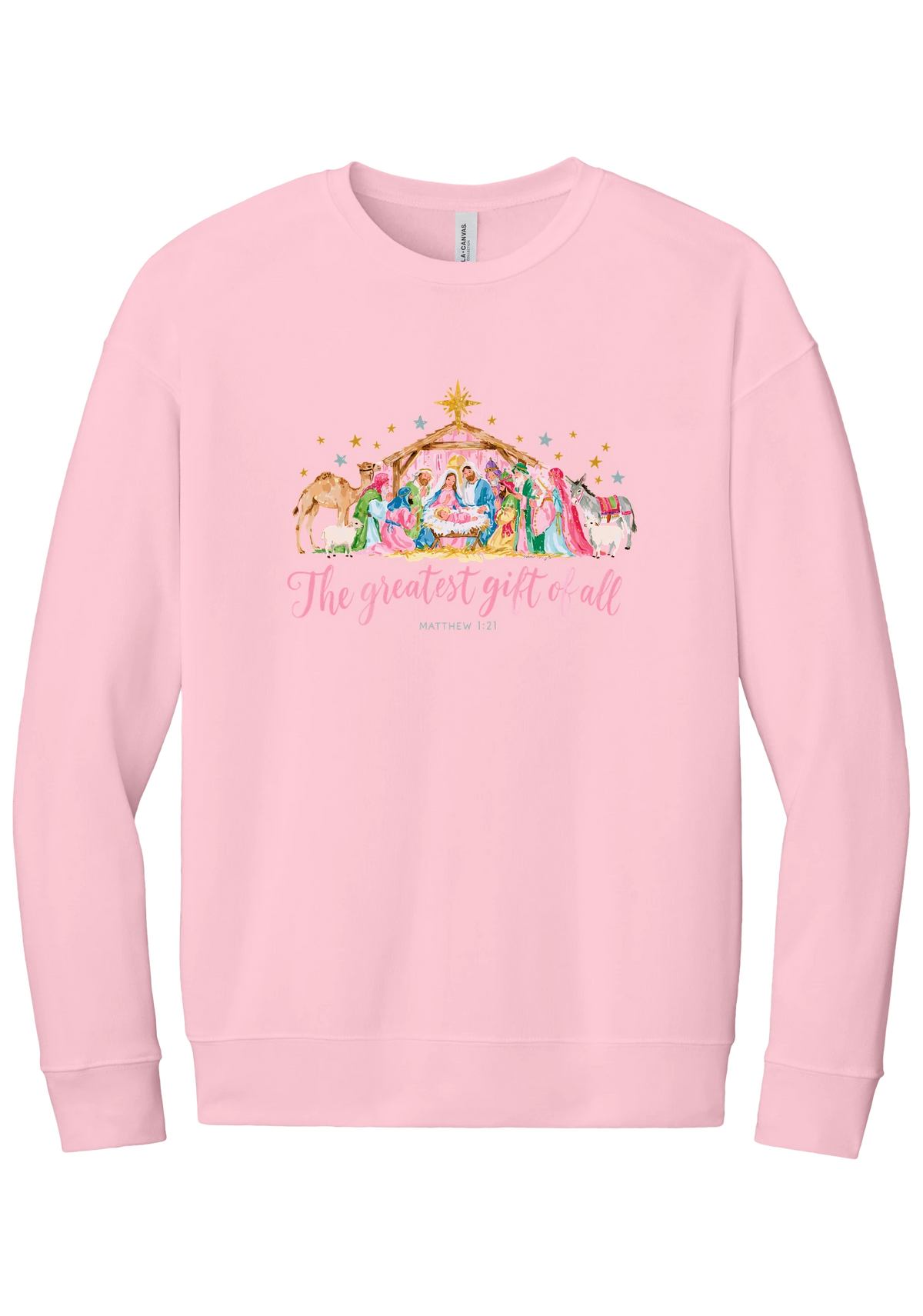 The Greatest Gift of All crewneck sweatshirt in Pink, featuring a pastel watercolor nativity scene under the star with The Greatest Gift of All script and Matthew 1:21