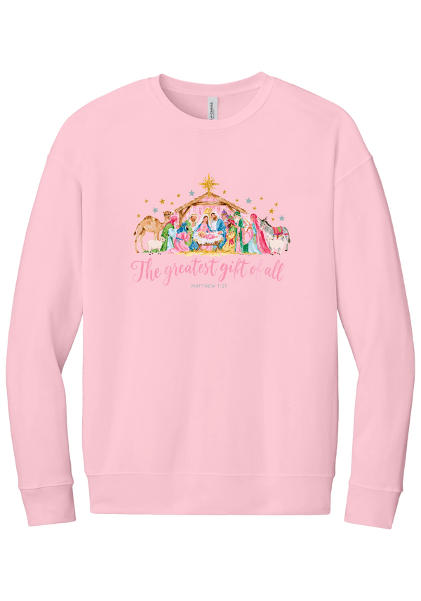 The Greatest Gift of All crewneck sweatshirt in Pink, featuring a pastel watercolor nativity scene under the star with The Greatest Gift of All script and Matthew 1:21