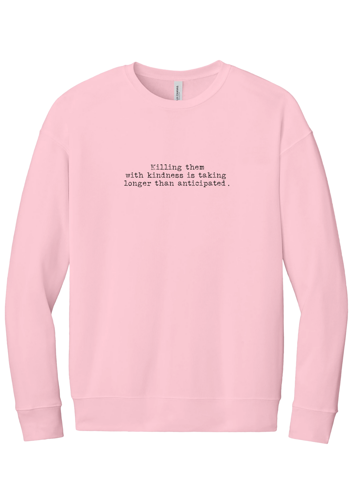 Killing Them With Kindness crewneck sweatshirt in Pink, featuring Killing them with kindness is taking longer than anticipated in distressed black typewriter letters