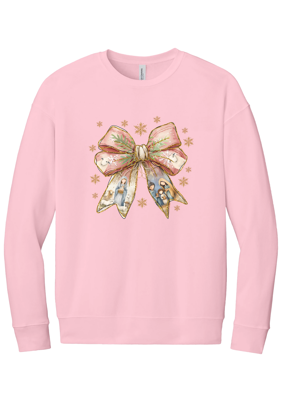 Nativity Bow crewneck sweatshirt in Pink, featuring a blush satin bow with painted nativity scenes in its ribbons and gold snowflakes