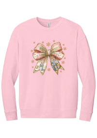 Nativity Bow crewneck sweatshirt in Pink, featuring a blush satin bow with painted nativity scenes in its ribbons and gold snowflakes