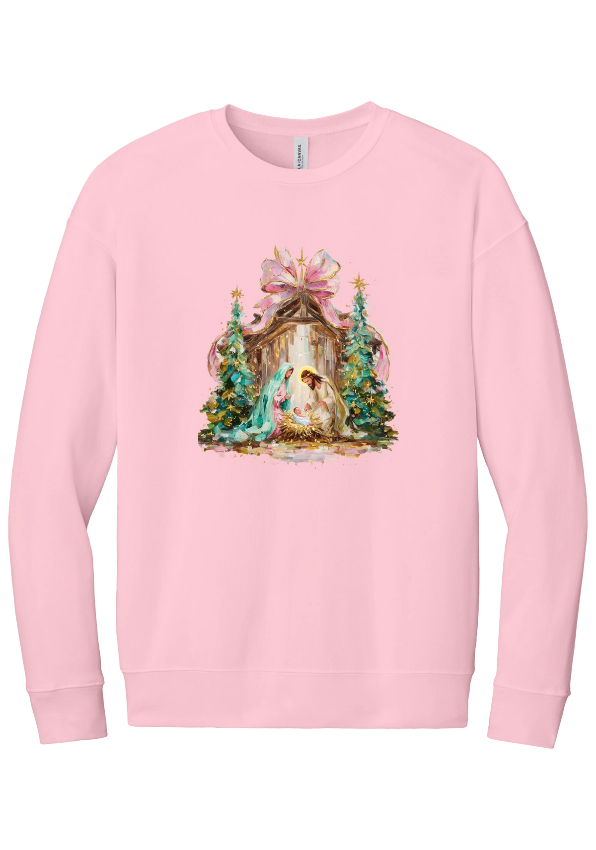 Painterly Nativity crewneck sweatshirt in Pink, featuring a painterly nativity scene with Mary, Joseph, and baby Jesus in a wooden stable between teal Christmas trees and a pink bow