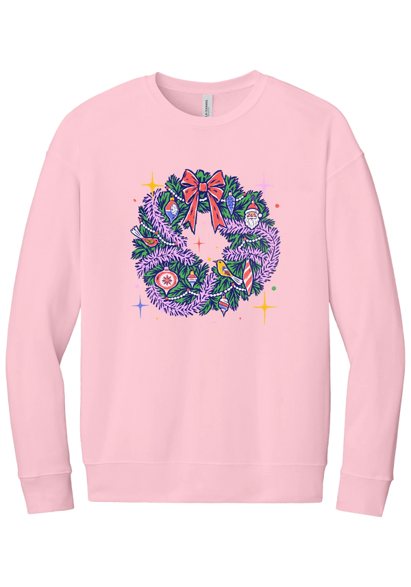 Retro Wreath crewneck sweatshirt in Pink, featuring a retro tinsel Christmas wreath with vintage ornaments and a red bow