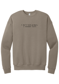 I Don't Hold Grudges crewneck sweatshirt in Tan, featuring I don't hold grudges, I remember facts in distressed black typewriter letters