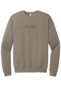 Live Laugh Leave Me Alone crewneck sweatshirt in Tan, featuring live. laugh. leave me alone. in distressed black typewriter letters